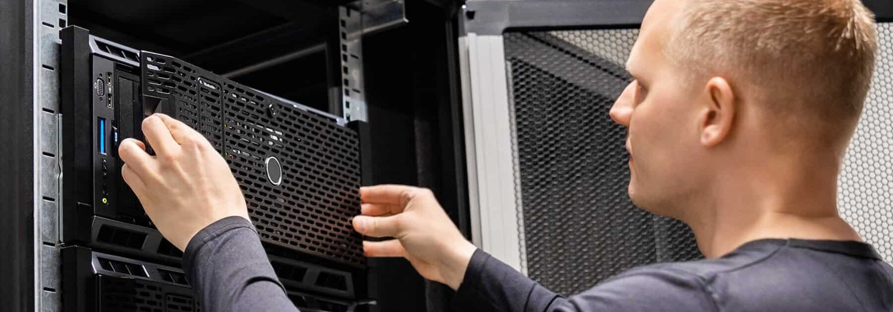 About male technician installing servers in enterprise d 2023 11 27 05 00 17 utc